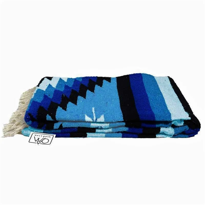 Folded Blue and White Mexican made blanket