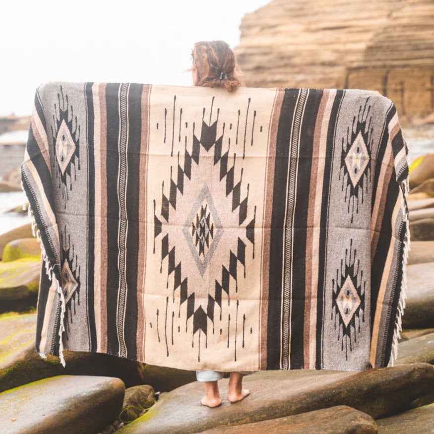 blanket being displayed at the beach